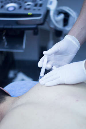 Intratissue Percutaneous Electrolysis EPI with needle injection medical procedure by physiotherapist...