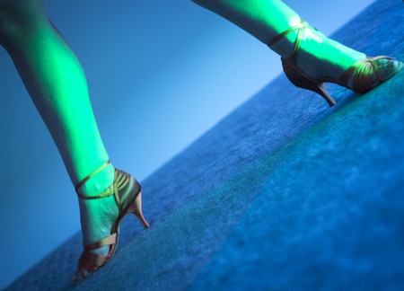 Attractive woman ballroom and salsa dance dancer and teacher with sexy legs dancing in nightclub party show.の写真素材