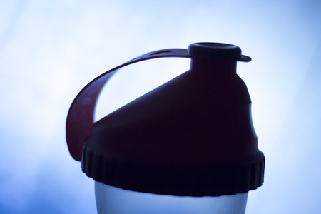 Whey powder protein shake shaker bottle for fitness and bodybuilding athletes after gym workout proteins drink.の写真素材