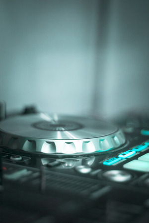 Ibiza dj turntables for deejay mixing in nightclub house music party at night during techno show.の写真素材