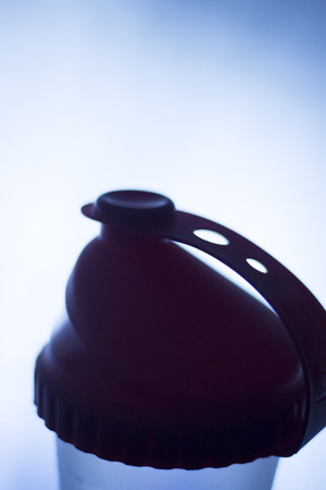 Whey powder protein shake shaker bottle for fitness and bodybuilding athletes after gym workout proteins drink.の写真素材