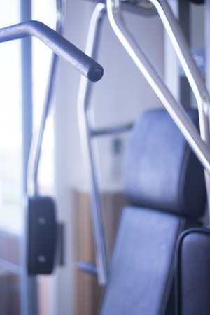 Gym exercise weight training resistance lat pulldown back machine in fitness studio used to increase strength and build muscle.の写真素材