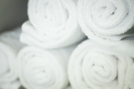 Fresh cotton owels in health club gymnasium spa rolled up ready to use.の写真素材