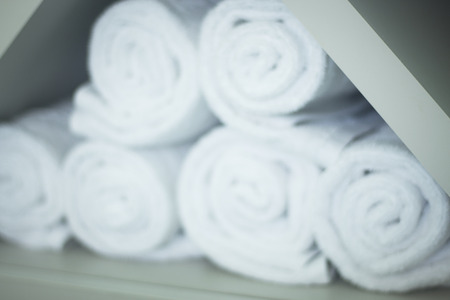 Fresh cotton owels in health club gymnasium spa rolled up ready to use.の写真素材