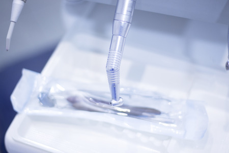 Dentists chair and drills in dental clinic office to treat patients with orthodontics.の写真素材