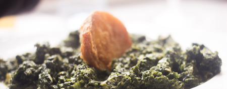 Spanish tapas spinach dish in restaurant bar photo in Spain.の写真素材