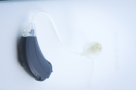 Modern digital hearing aid device for deaf and hard of hearing patients.の写真素材