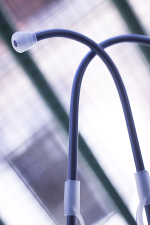 Medical doctor's stethoscope used to listen to patient heart rate, beats and monitor irregular heart beatsの写真素材