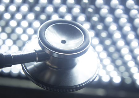 Medical doctor's stethoscope used to listen to patient heart rate, beats and monitor irregular heart beatsの写真素材