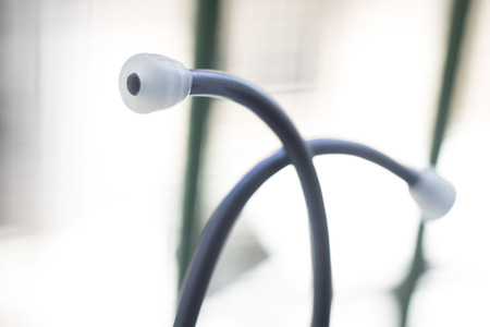 Medical doctor's stethoscope used to listen to patient heart rate, beats and monitor irregular heart...