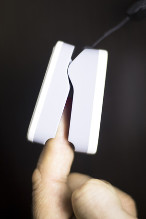 Portable hand held domestic cardiac finger pulse rate meter to show resting heart rate in monitored patient.の写真素材