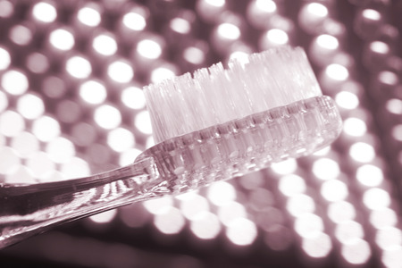 Tooth brush isolated in creative artistic photo.の写真素材