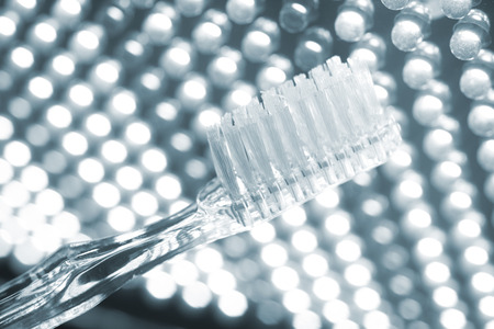 Tooth brush isolated in creative artistic photo.の写真素材