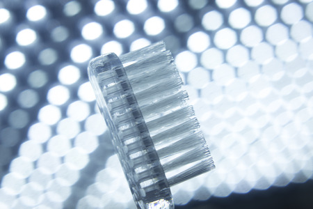 Tooth brush isolated in creative artistic photo.の写真素材