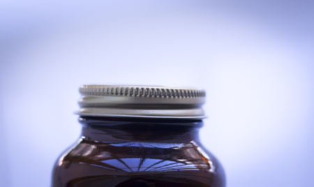 Multi vitamin mineral supplement capsule pills jar.