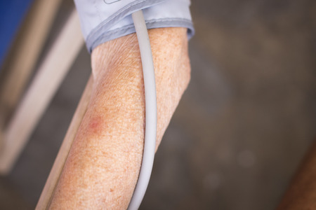 Cardiac blood pressure and irregular heart beat pulse rate meter to show resting heart rate in monitored old aged female patient.の写真素材