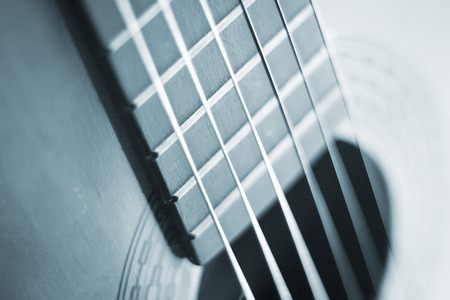 Spanish traditional flamenco wooden acoustic guitar strings and fretboard.