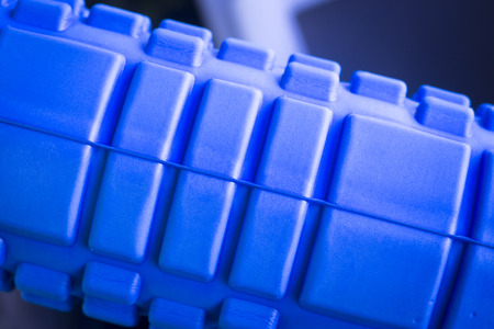 Foam physiotherapy, fitness sports self massage roller used to roll out tired, sore muscles, tension, strains and to increase muscle flexibility.の写真素材