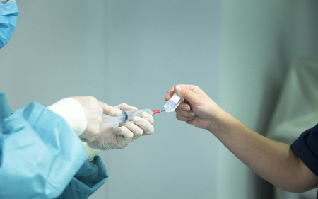 Surgery anaesthetic hypodermic syringe instrumentation in emergency room operating theater operation.の写真素材