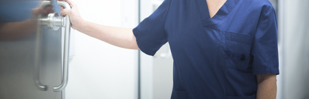 Surgeon in operating theater emergency room surgery in hospital clinic in blue surgical sterile uniform for operation.の写真素材