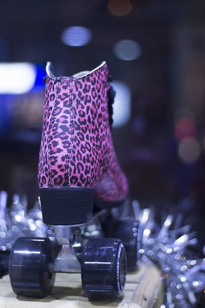 Quad skate rollerskates in skate store in shop window display. Skates with four wheels and front brake for roller disco and jam skating.の写真素材