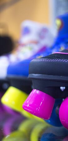 Quad skate rollerskates in skate store in shop window display. Skates with four wheels and front brake for roller disco and jam skating.の写真素材