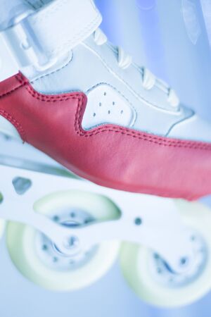 Freestyle girls pink inline skates boots and wheels in retail store shop window for free, urban, slalom, fitness and recreational skating.の写真素材