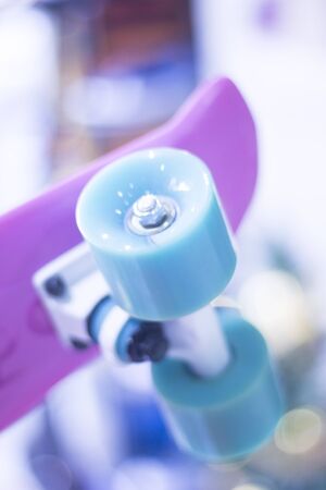 Skate board and wheels, axle and bearings in skates store on display in shop window on sale new and shiny.の写真素材