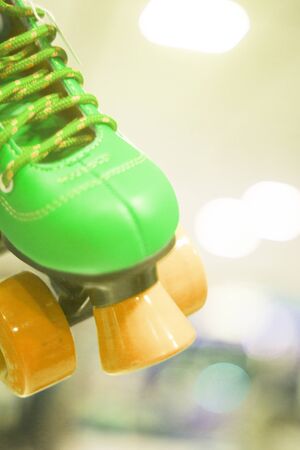 Childrens quad skate rollerskates in skate store in shop window display. Skates with four wheels and front brake for roller disco.の写真素材