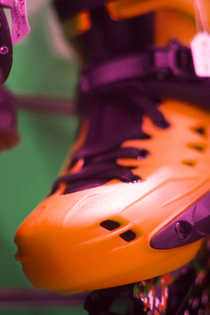 Freestyle inline skates boots and wheels in retail store shop window for free, urban, slalom, fitness and recreational skating.の写真素材