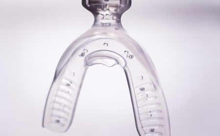 Teeth invisible brackets orthodontic dental tooth vibrator to accelerate orthodontics alignment straightening dentist treatment.の写真素材