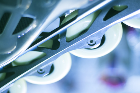 Freestyle inline skates boots and wheels in retail store shop window for free, urban, slalom, fitness and recreational skating.の写真素材