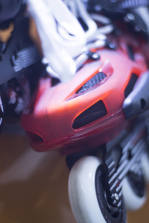 Freestyle inline skates boots and wheels in retail store shop window for free, urban, slalom, fitness and recreational skating.の写真素材