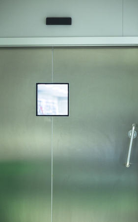 Hospital surgery operating theater emergency room stainless steel door.の写真素材
