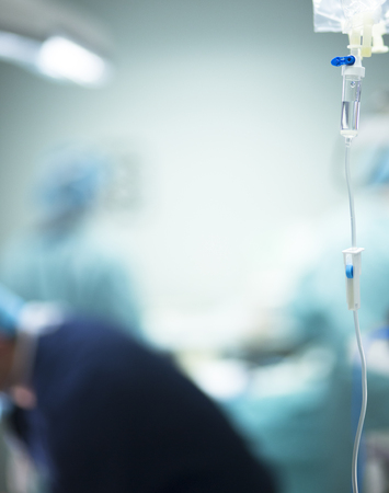 Hospital surgery medical drip in emergency room operating theater ward in medical clinic.の写真素材