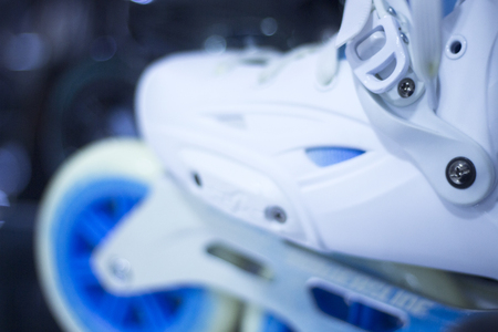 Freestyle inline skates boots and wheels in retail store shop window for free, urban, slalom, fitness and recreational skating.の写真素材