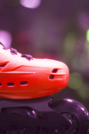 Freestyle inline skates boots and wheels in retail store shop window for free, urban, slalom, fitness and recreational skating.の写真素材