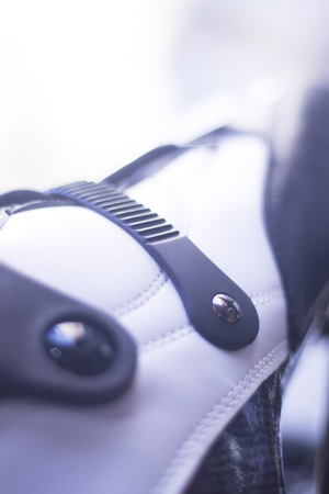 Freestyle inline skates boots and wheels in retail store shop window for free, urban, slalom, fitness and recreational skating.の写真素材