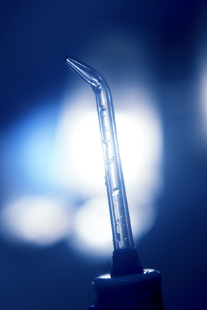 Water jet dental cleaner head to liquid floss each tooth and between teeth in brushing and cleaning of teeth.の写真素材