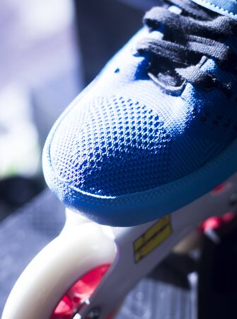 Inline freestyle new roller skates in retail skate shop window display on sale.