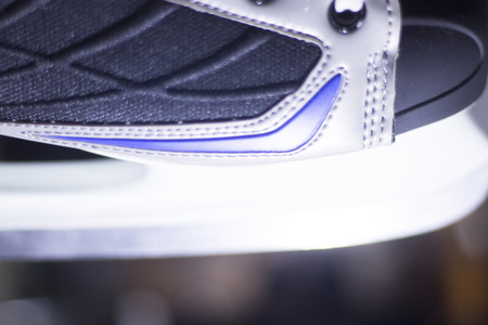 Ice skates in skate store shop window on display on sale for skating on ice and figure skating.の写真素材