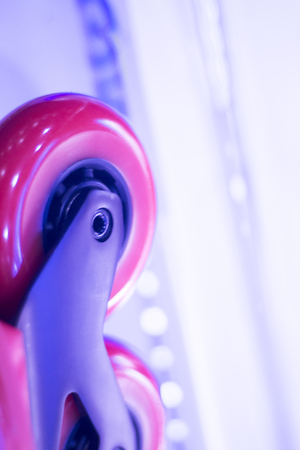 Freestyle inline skates boots and wheels in retail store shop window for free, urban, slalom, fitness and recreational skating.の写真素材