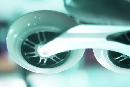 Freestyle inline skates boots and wheels in retail store shop window for free, urban, slalom, fitness and recreational skating.の写真素材