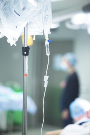 Hospital surgery medical drip in emergency room operating theater ward in medical clinic.の写真素材