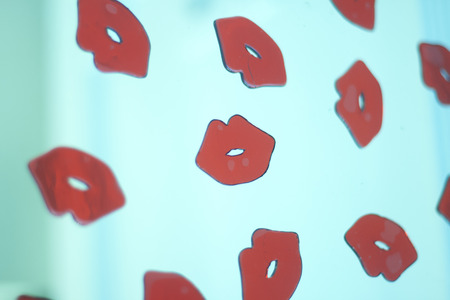 Red lips shapes female lipstick makeup abstract multiple image artistic creation.の写真素材
