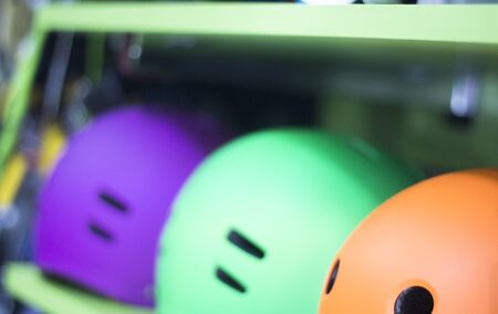 Inline and quad roller skates helmets head protection in retail skate shop display on sale.の写真素材