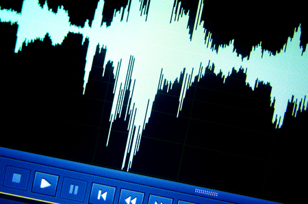 Sound recording studio audio wave on computer screen in professional editing program for voice, vocal, dj deejay musical mixingの写真素材