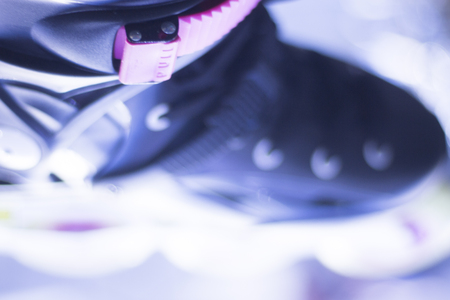 Freestyle inline skates boots and wheels in retail store shop window for free, urban, slalom, fitness and recreational skating.の写真素材