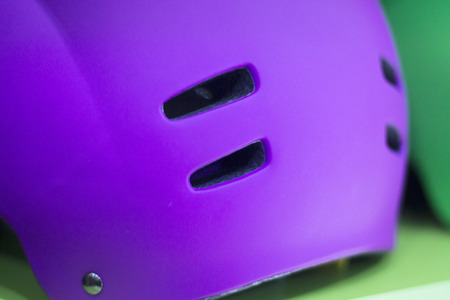 Inline and quad roller skates helmet head protection in retail skate shop display on sale.の写真素材
