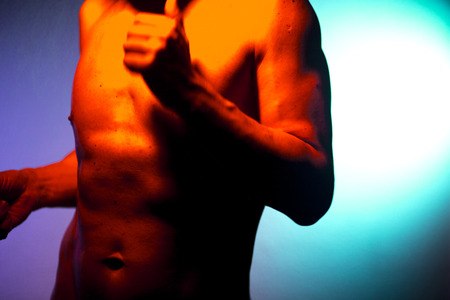 Nude sporty slim attractive muscular fit male model man naked with strong six pack abs, obliques muscles, chest and arms.の写真素材
